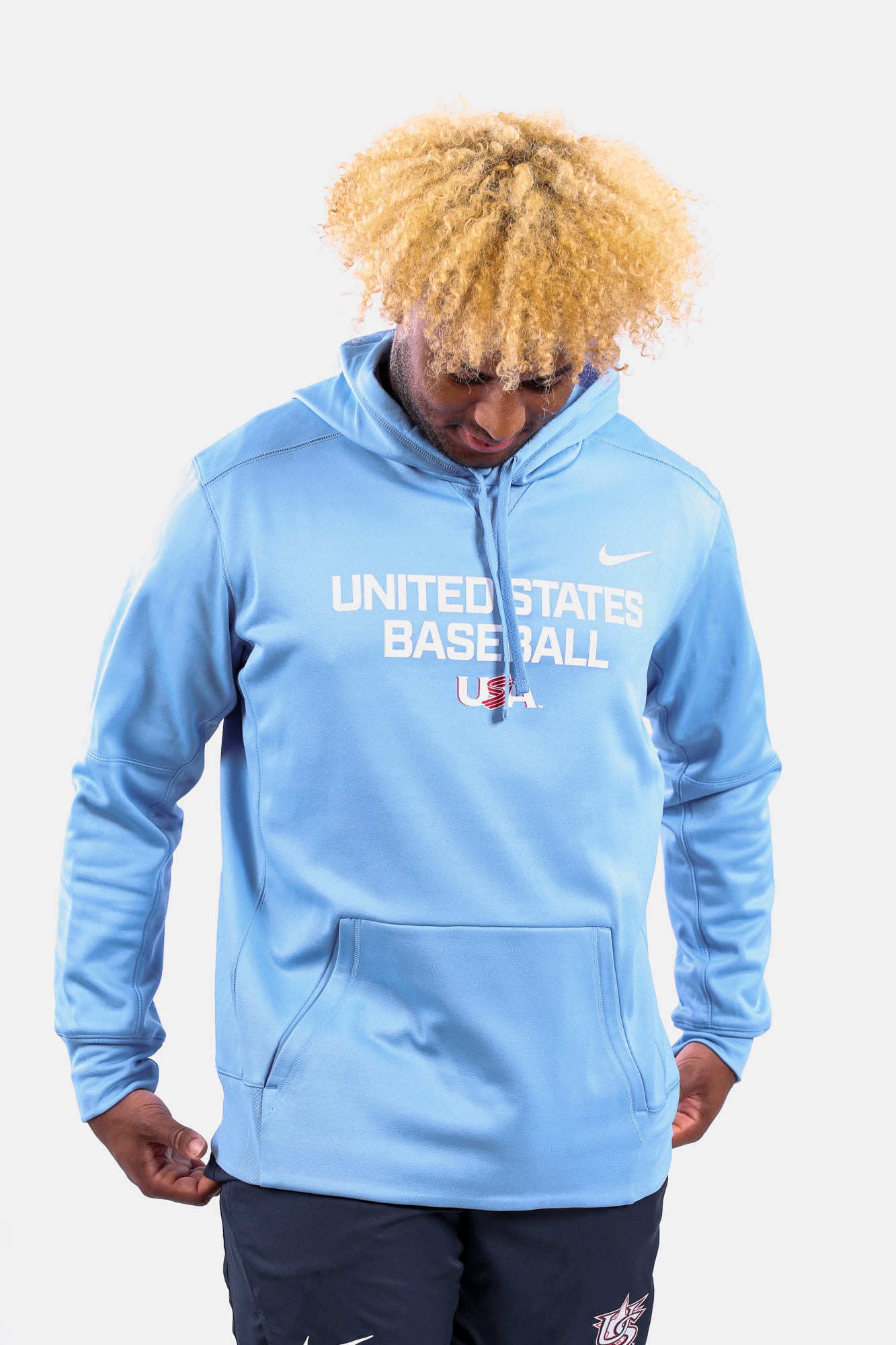 Male model wearing the Light Blue Foundation Therma Hoodie featuring the USA Baseball Jersey Logo