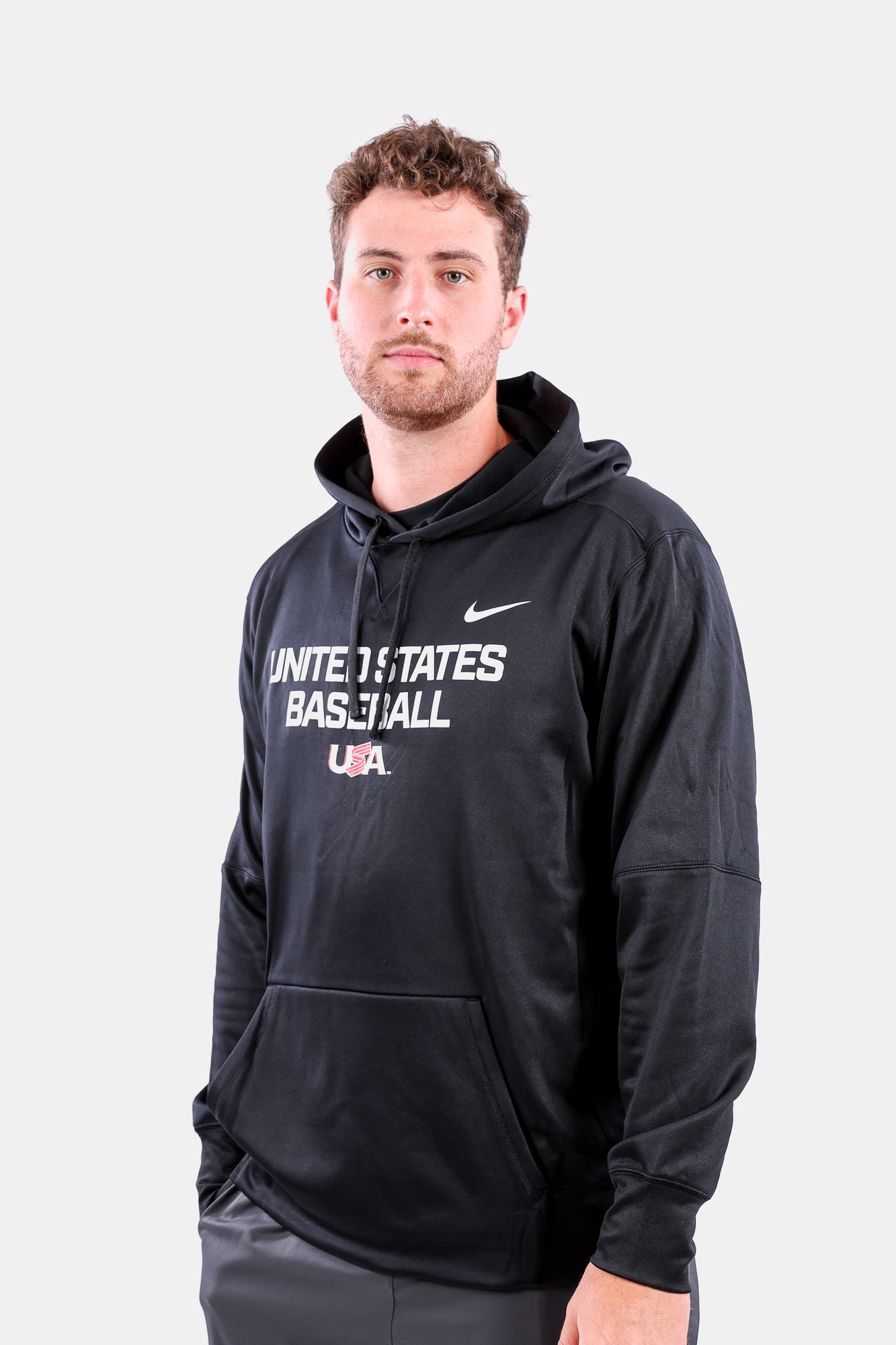 Male model wearing the Black Foundation Therma Hoodie featuring the USA Baseball Jersey Logo