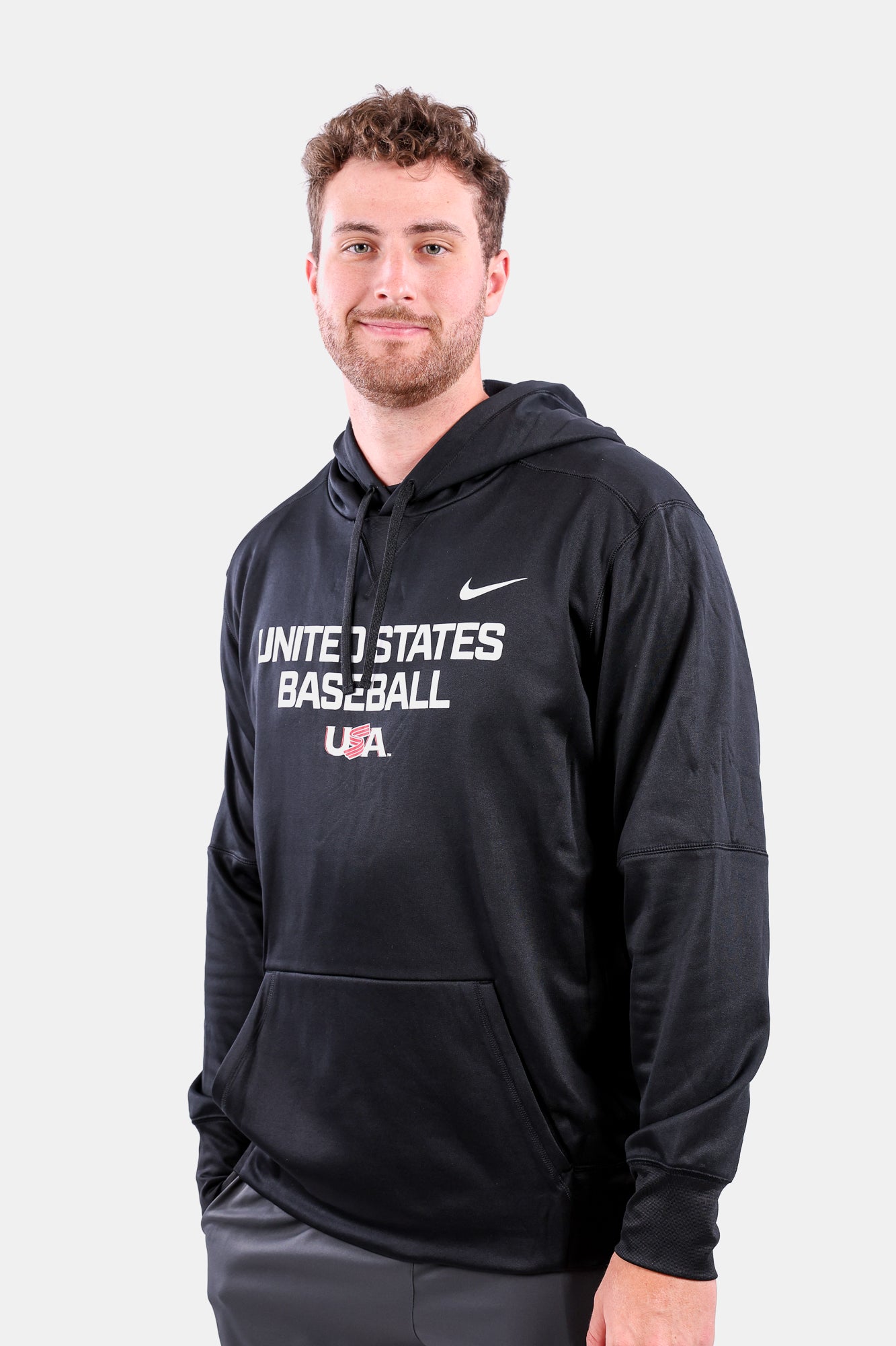 Male model wearing the Black Foundation Therma Hoodie featuring the USA Baseball Jersey Logo