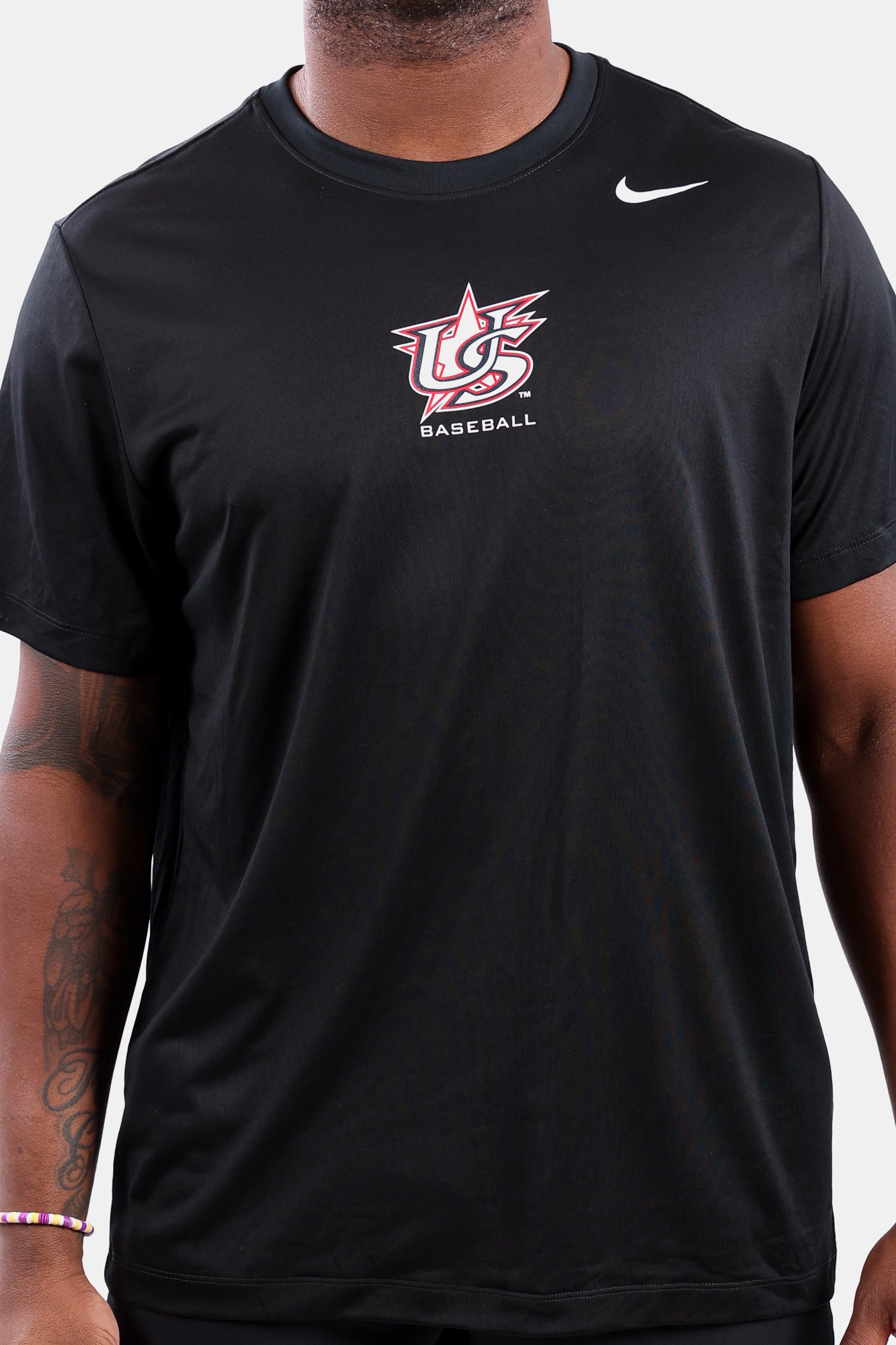 Detail shot of male model wearing Black Legend Tee