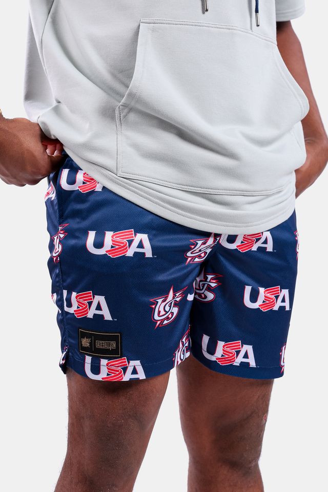 Detail shot of a male model wearing the USA x Baseballism Diamond Air Mesh Shorts with a repeated USA Baseball logo pattern