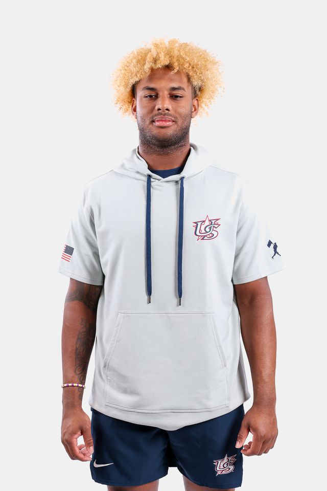 Male model wearing the USA x Baseballism Grey Short Sleeve Hoodie featuring the USA Baseball Star logo