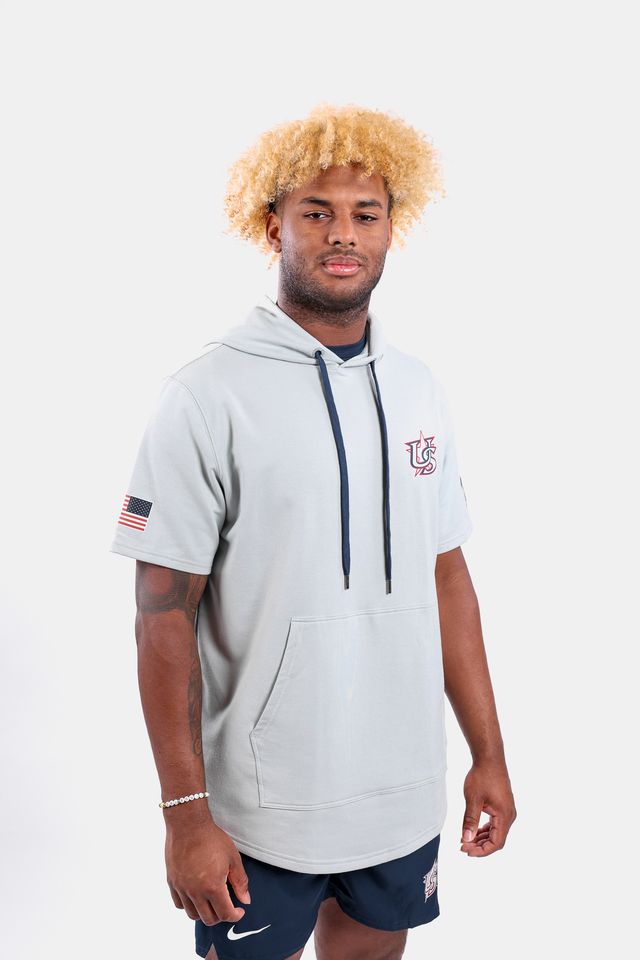 Male model wearing the USA x Baseballism Grey Short Sleeve Hoodie featuring the USA Baseball Star logo