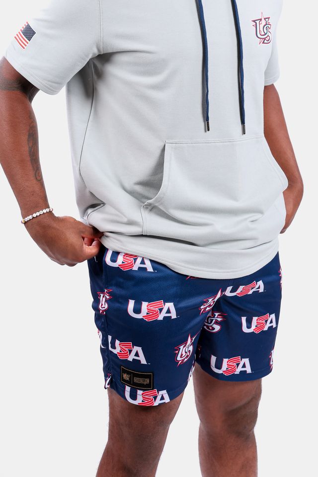 Male model wearing the USA x Baseballism Diamond Air Mesh Shorts with a repeated USA Baseball logo pattern