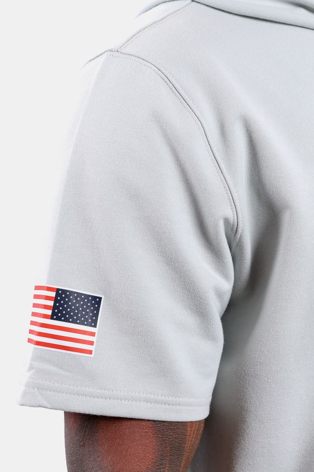 Detail shot of USA Baseball screen-printed Flag logo on the USA x Baseballism Grey Short Sleeve Hoodie 